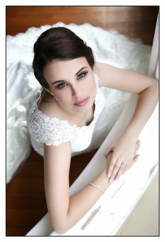 Bride in lace wedding dress from above